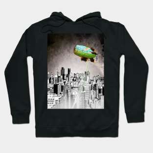 A Message green daisy blimp hovers over a cold gray city Hoodie